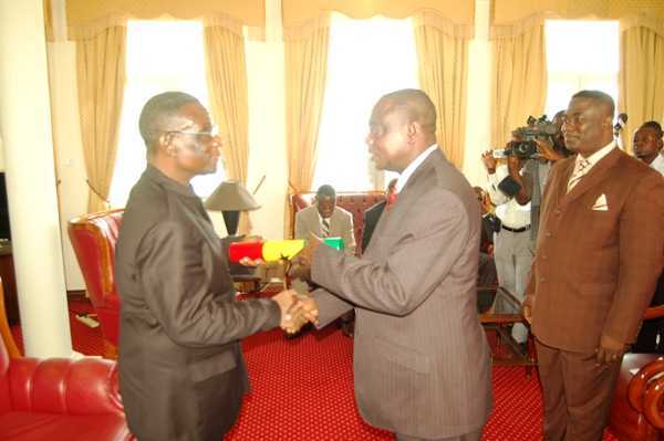 President Mills Presenting the Instrument of Office to Minister of Health, Dr Kumbour at the Osu Castle  - Ben Kumbour