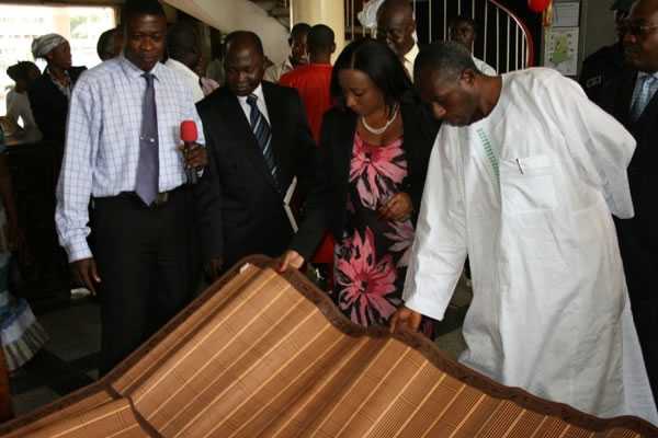 Mr. Collins Dauda, (right) Minister of Lands and Natural Resources looking at exhibited items on display,  Mrs. Zita Okaikoi (left) Minister of Information and some another Chief executives from the Ministry  - Alhaji Collins Dauda