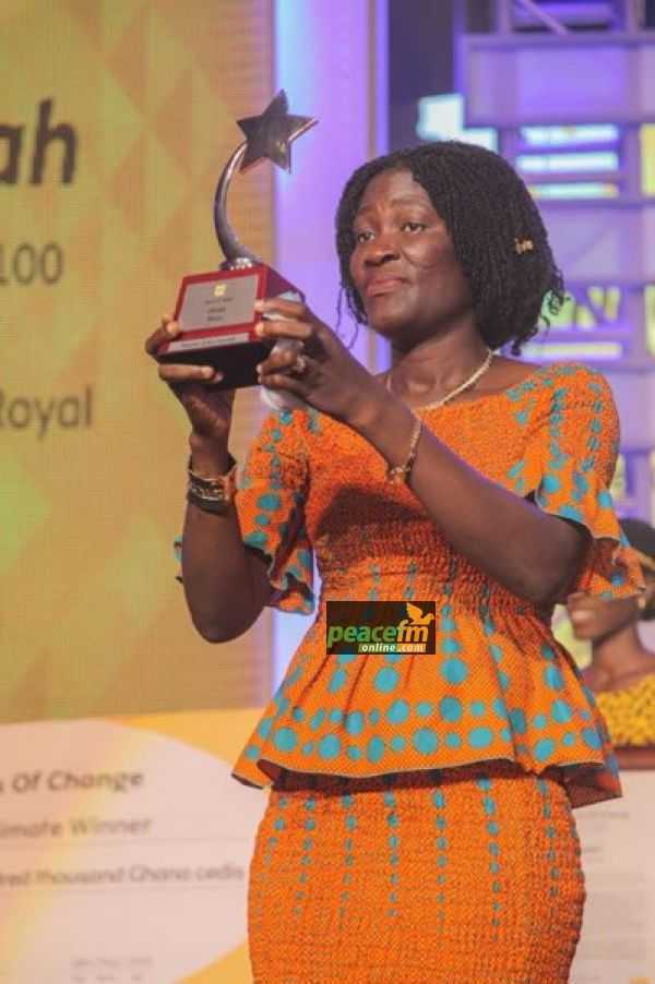 Madam Naomi Amoah Hoisting The Plaque That Was Presented To Her  - Adam